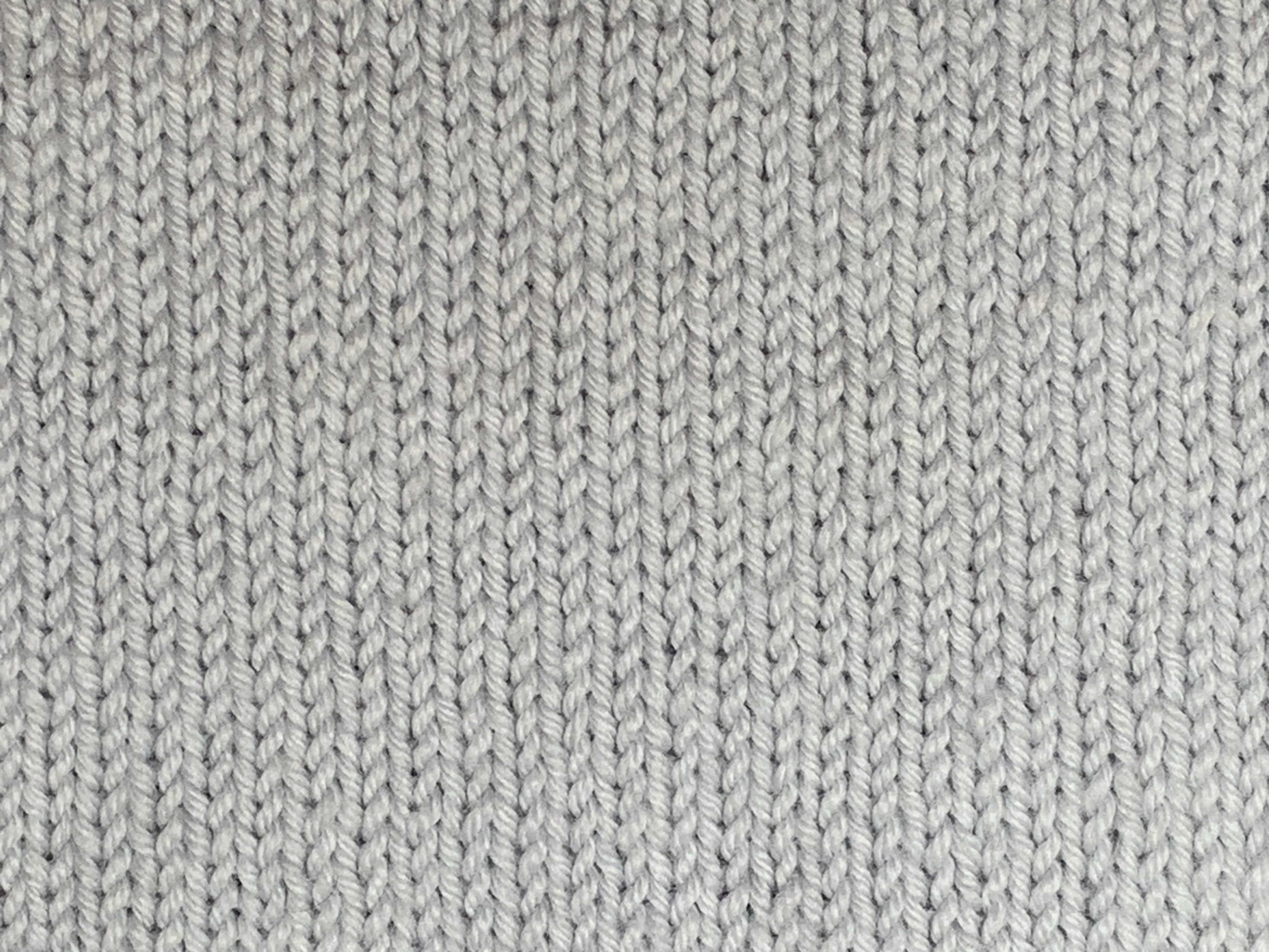 The right side of stockinette, characterized by rows of “V” shaped knit stitches.